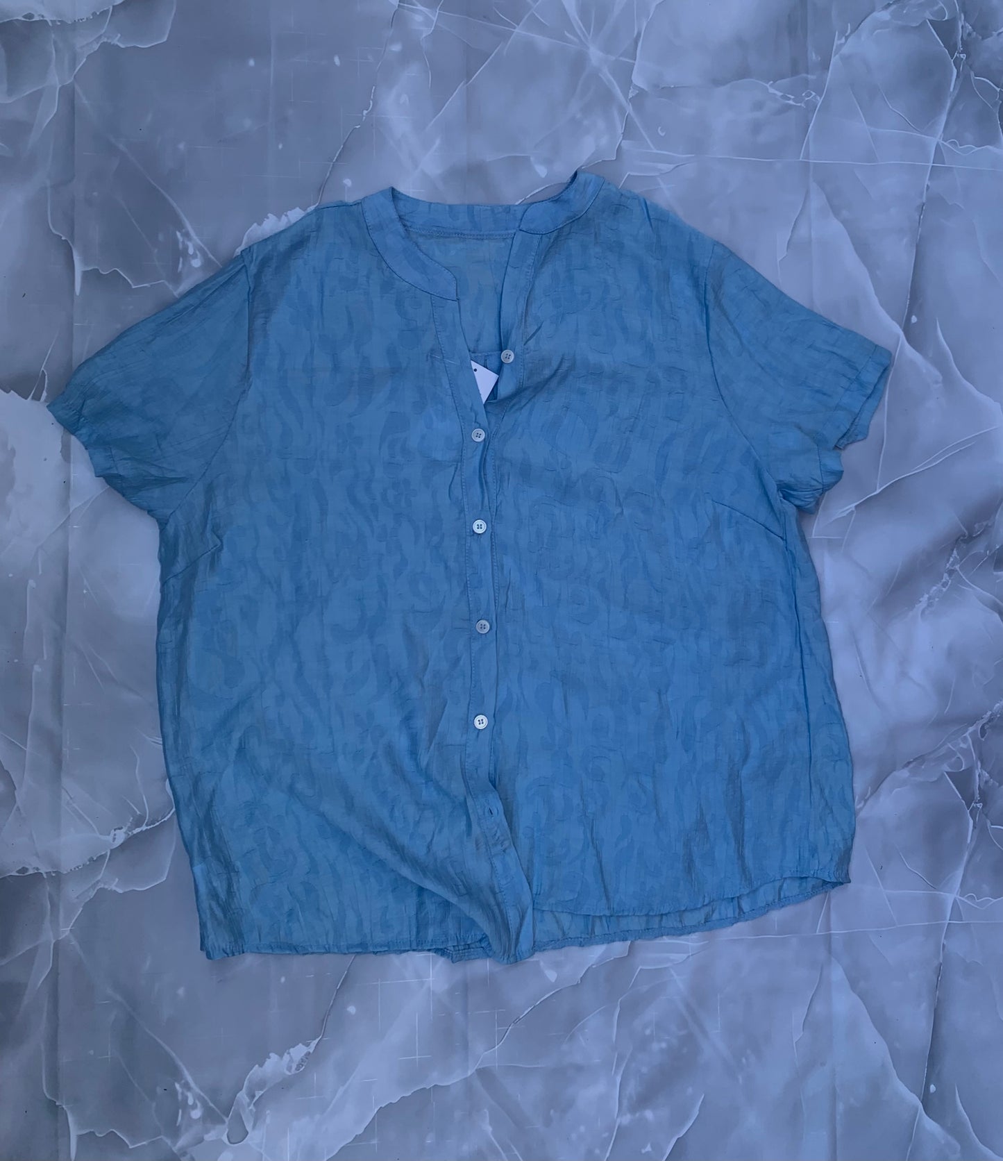 Blusa de lino jacquard en relieve — cuello mao